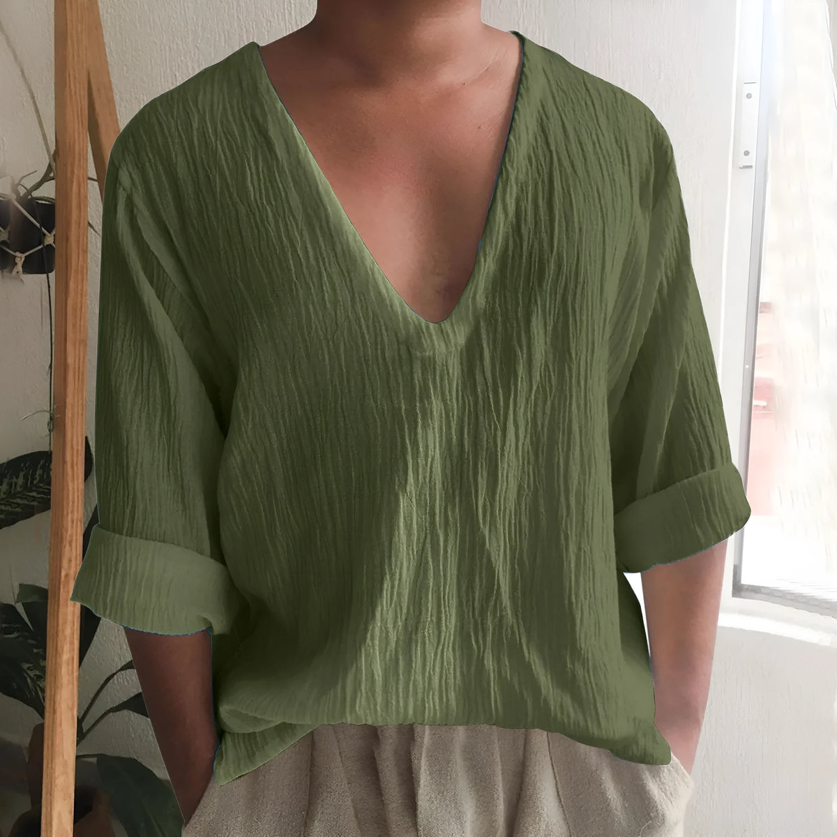 Men's washed cotton long sleeve V-neck t-shirt in a solid colour.