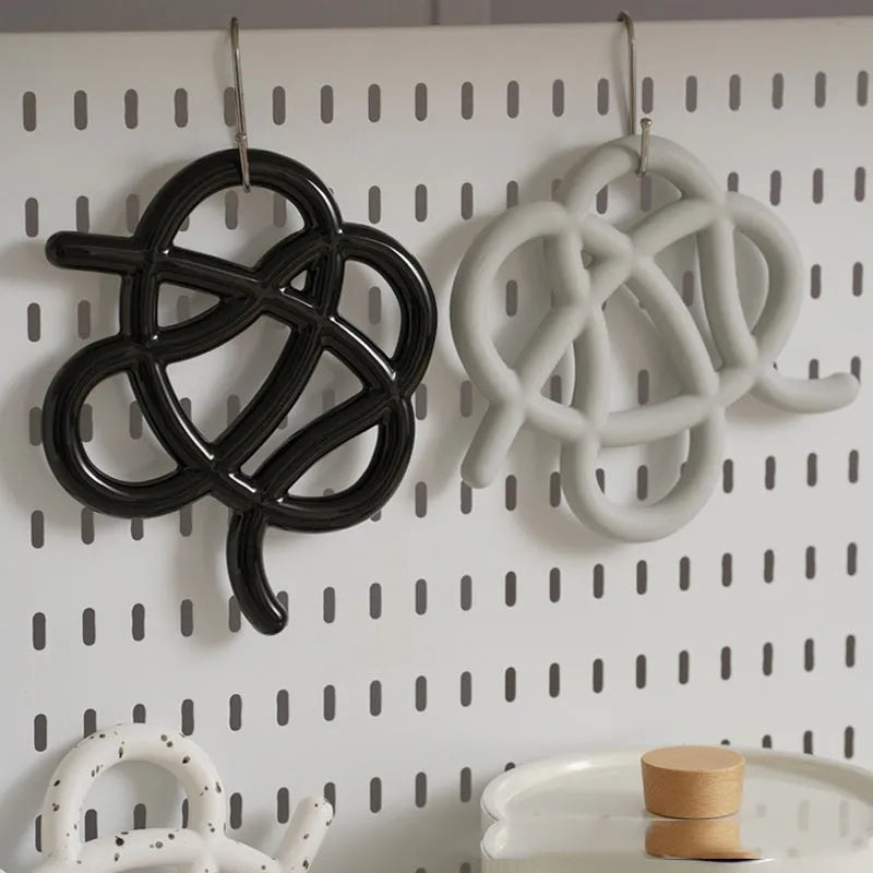 Ceramic heat proof placemat in irregular shape on a dining table