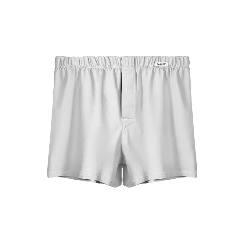 Men's loose-fitting cotton boxer shorts in gold, green, sea blue or light grey colours with mid-waist design