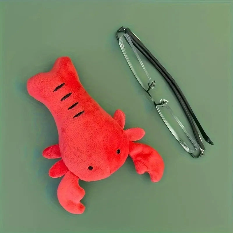Red lobster stuffed squeaky dog toy for small and medium breeds on white background