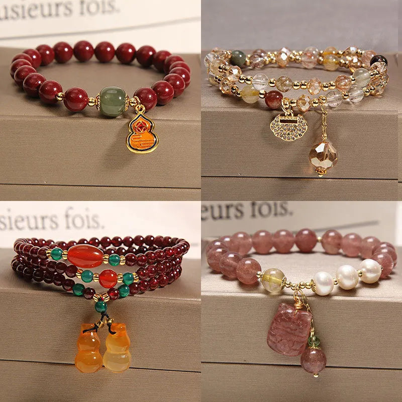 Women's multi-strand crystal bracelet with garnet, pearl, quartz, and jade pendants in Korean style design.