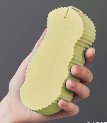 White 3D bath sponge with fish scale pattern for gentle body exfoliation