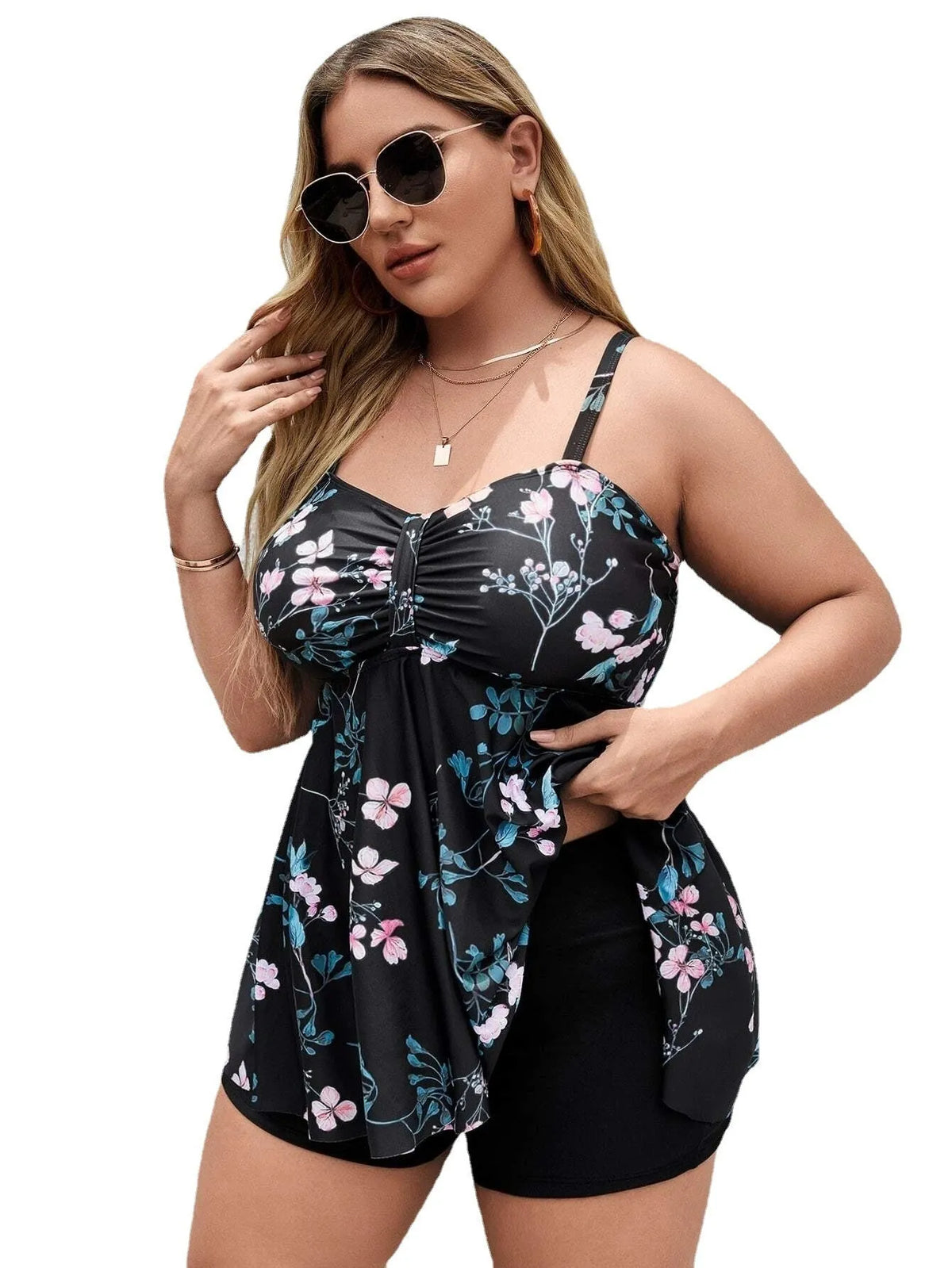 Women's floral print one-piece swimsuit on a hanger, showing split colour design and plus size fit.