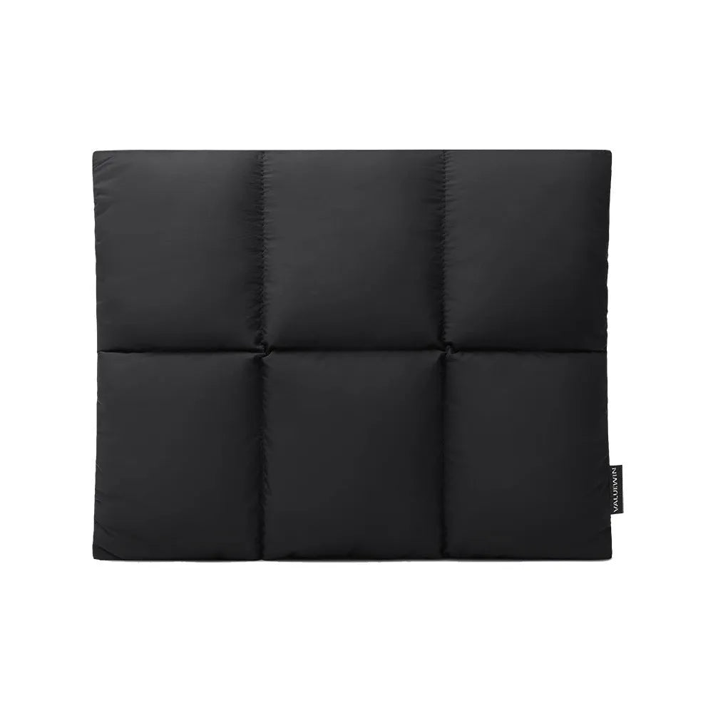 Soft fluffy black laptop sleeve with sewing thread details for 13 to 15.6 inch devices.