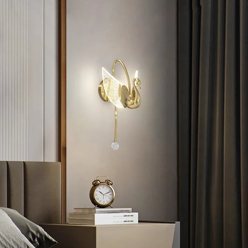 Gold-finish iron swan bedside wall lamp with acrylic shade and dimmable LED light.