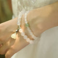 Women's S925 silver bracelet with white agate and Hetian jade stones in geometric lotus pattern