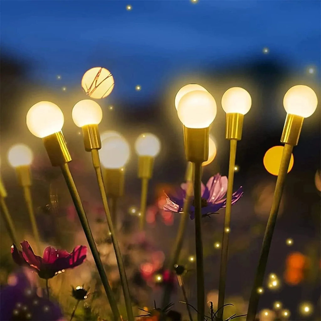 Solar-powered LED firefly lawn light with multiple heads and a stainless steel ground spike