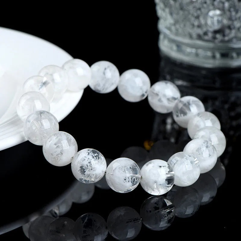 Women's crystal bracelet with round blizzard snowflake beads and ruyi xiangyun charm.