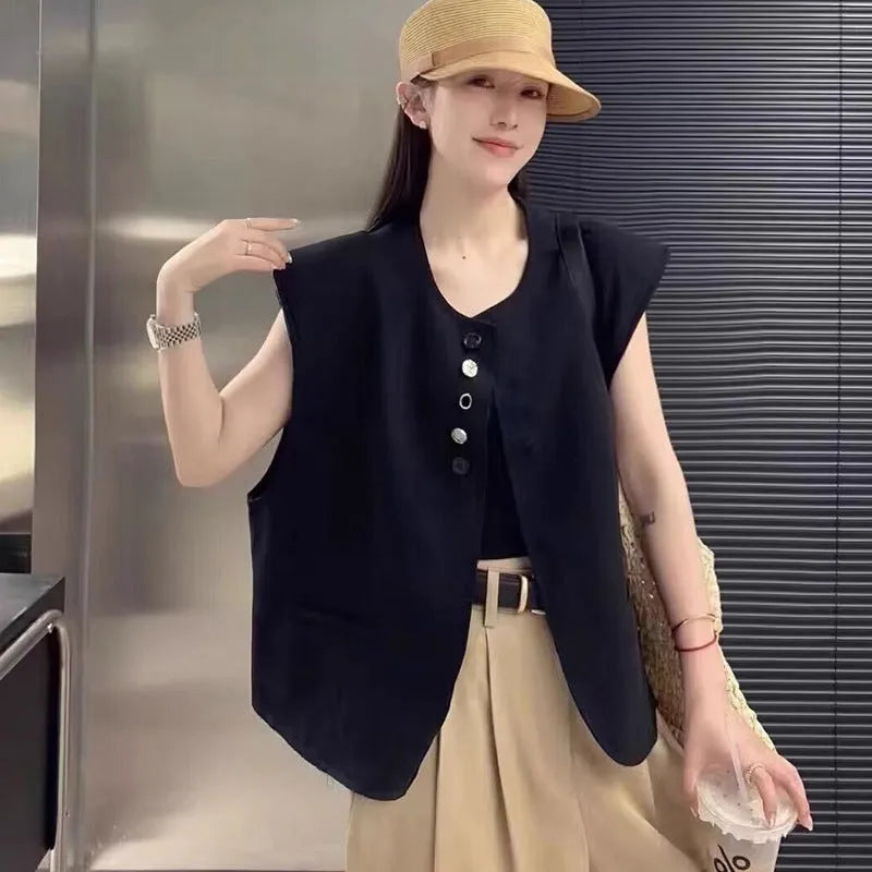 Women's loose-fit short vest in milky white with a chest pocket, shown on a hanger.