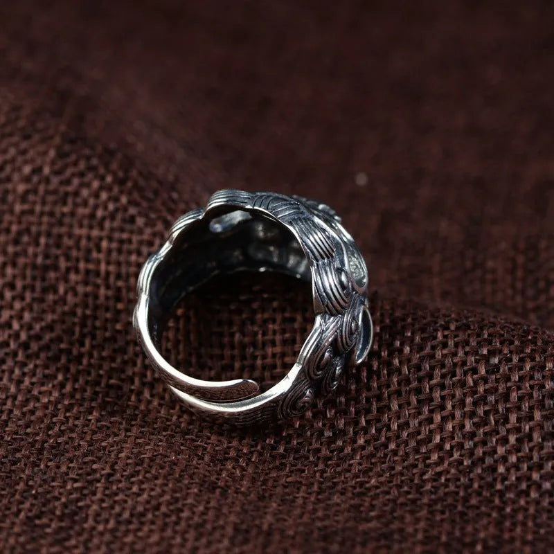 Silver open ring with Jibeast pattern and diamond detailing in retro zodiac design