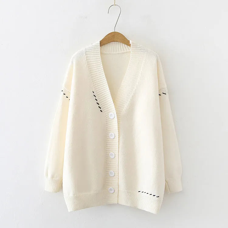 Women's black knitted cardigan top coat with long sleeves and loose fit made from polyester fabric