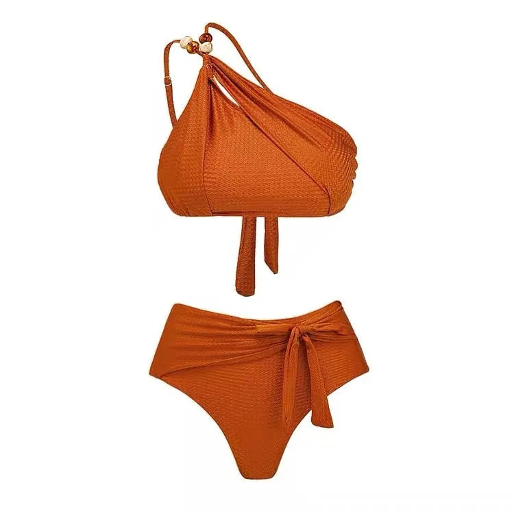 Brown women's high-waisted swimsuit with push-up top and a sheer black chiffon dress overlay.