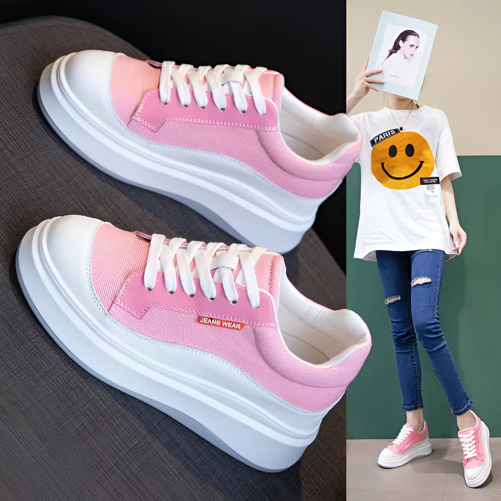 Women's pink leather board shoes with thick flat soles on a neutral background.