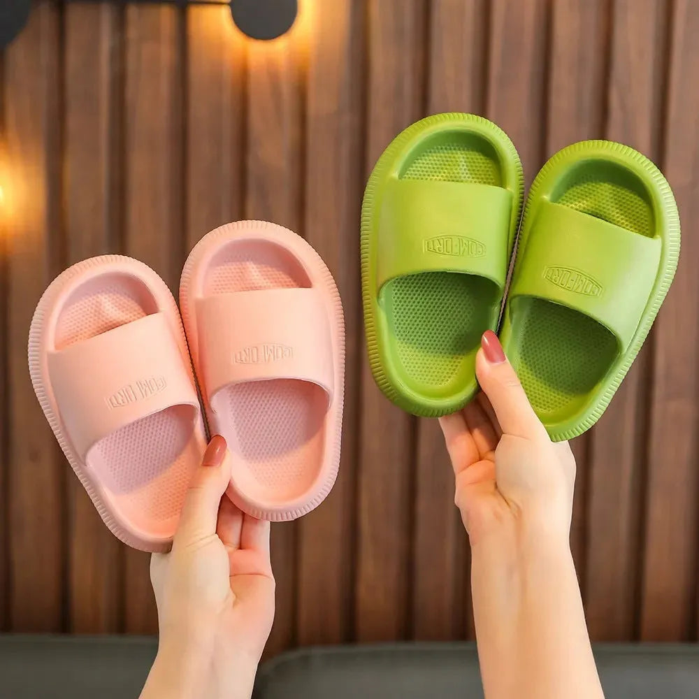 Children's EVA slippers in mixed colours with a textured non-slip sole, shown in sizes for kids.