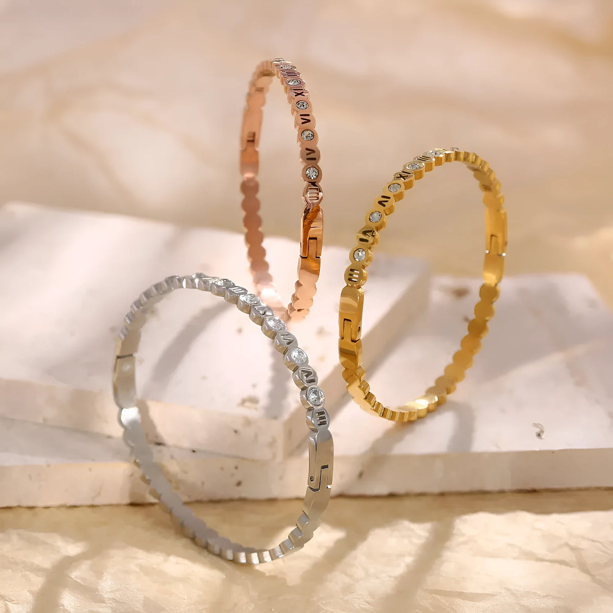 Titanium steel bracelet with number engraving in Korean style, shown in gold, rose gold, and steel colour options