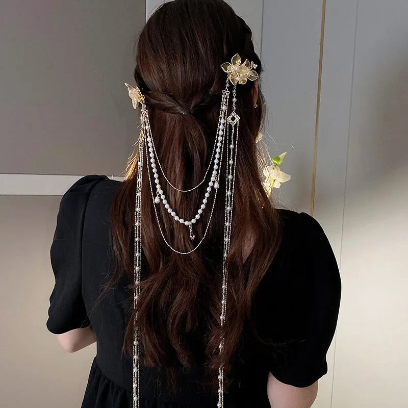 Gold women's hairpin with diamond grip and long tassel design