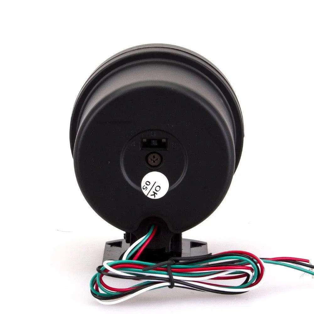 Black plastic automotive tachometer with blue indicator light for engine RPM measurement.