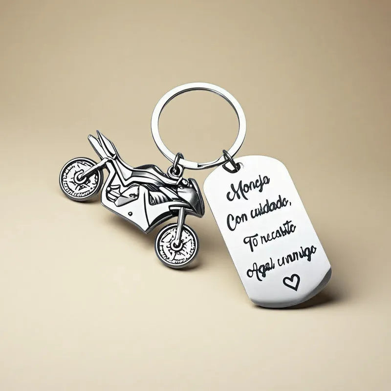 Stainless steel motorcycle keychain with inspirational engraving and a flannel storage bag.