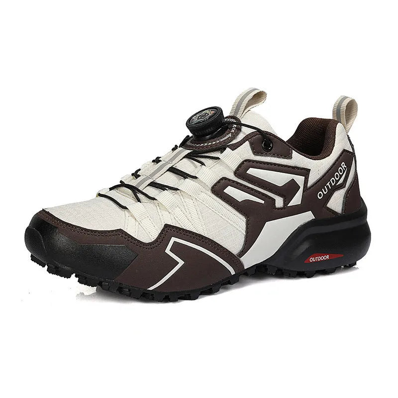 Men's beige elastic band hiking shoes with a natural rubber sole on an outdoor path.