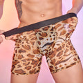 Men's leopard print nylon boxer shorts laid flat, showing the bold animal pattern and elastic waistband.