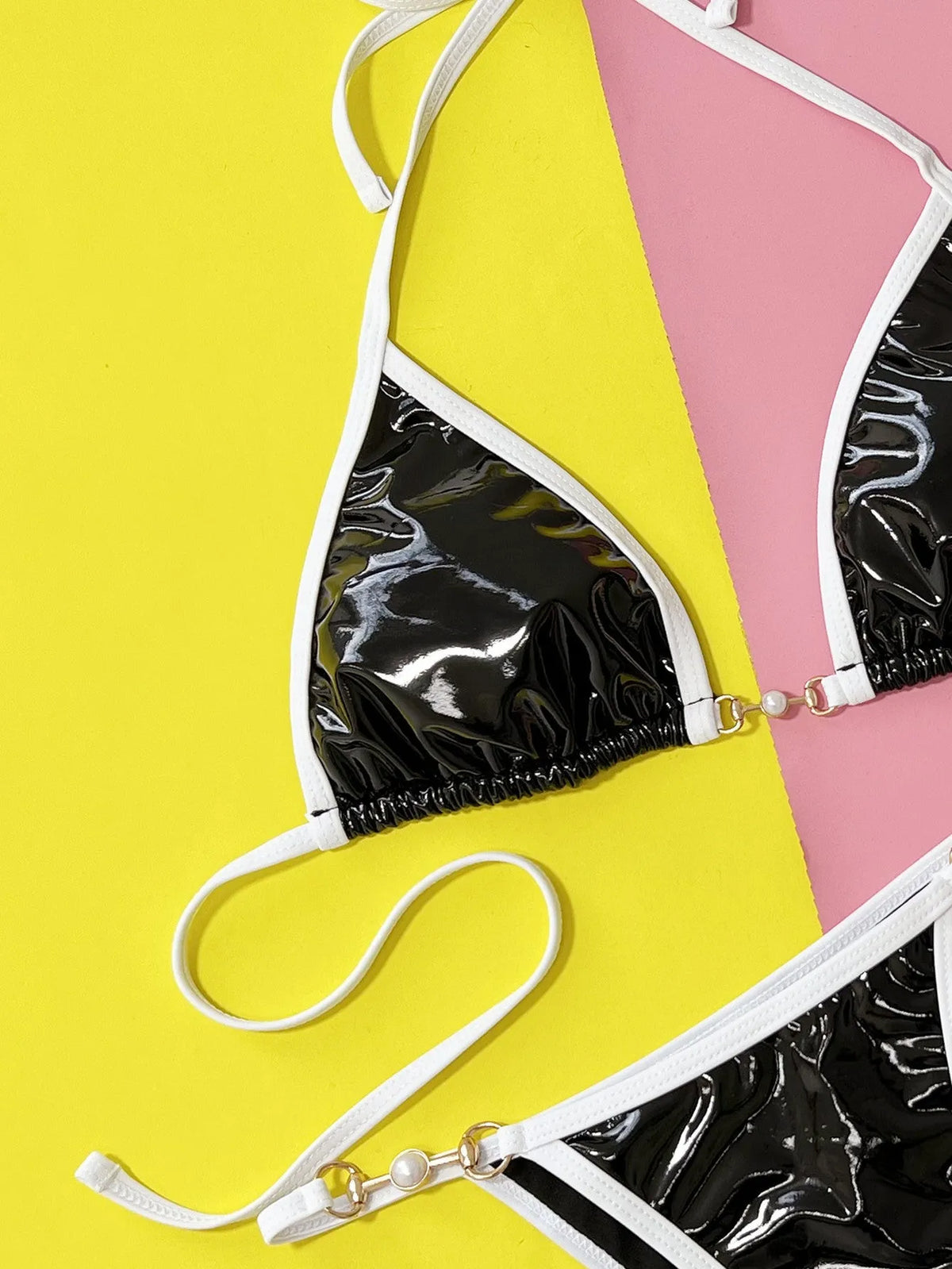 Black women's two-piece split bikini swimsuit with solid colour design