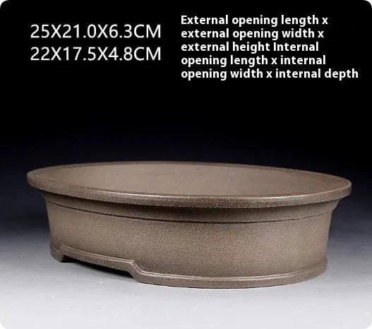 Handmade purple sand ceramic bonsai flower pot with antique oval shape measuring 25x21x6.3cm