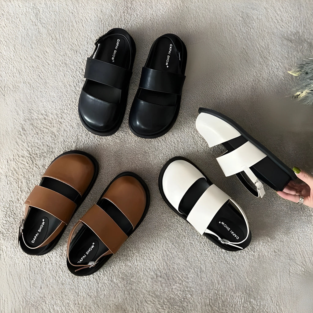 Retro brown women's ankle-strap buckle sandals with a closed toe and microfiber upper.