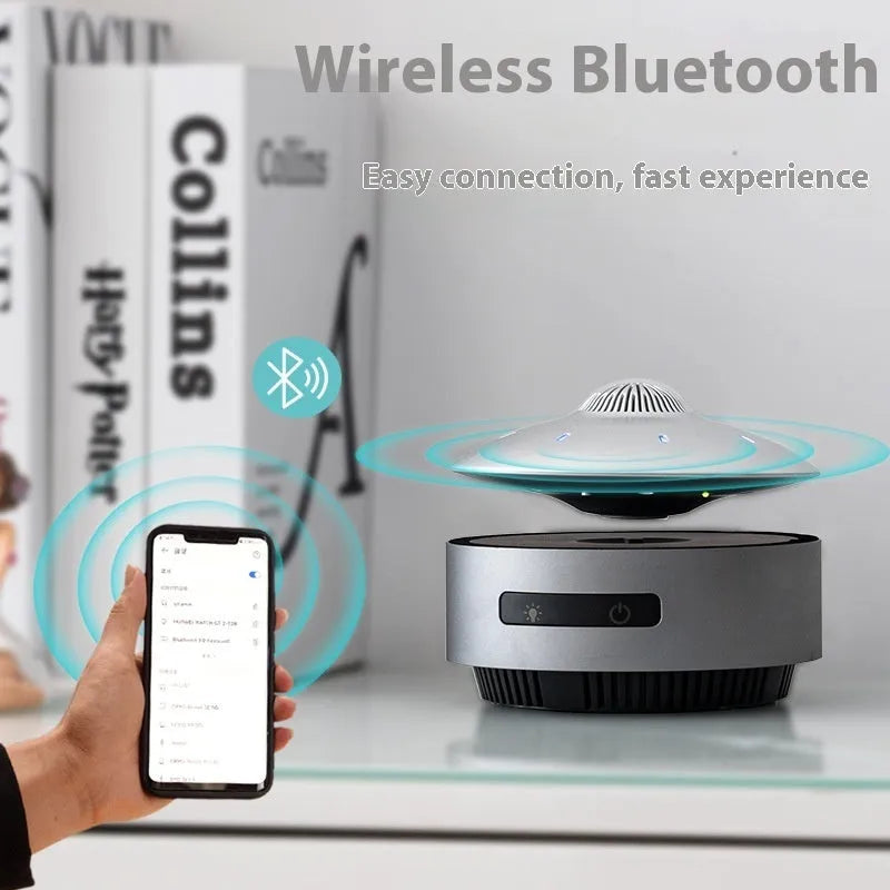 Magnetic levitation Bluetooth speaker hovering above its base in automatic lifting audio colour.