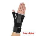 Black sports wrist guard with carbon fibre panel and grey thumb strap for left hand support