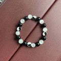 Natural stone Tai Chi bracelet with 10mm opal and black agate beads in traditional Chinese design