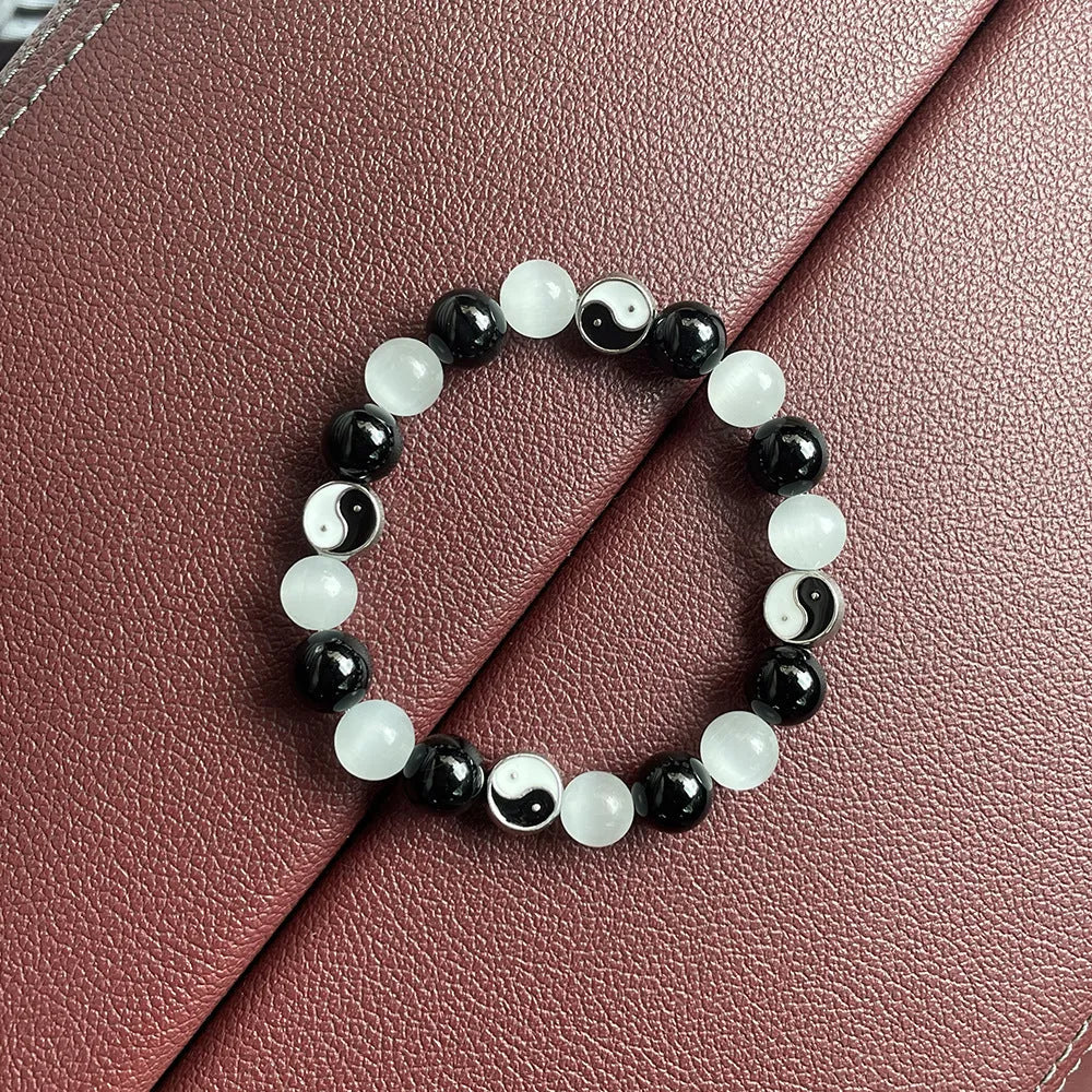 Natural stone Tai Chi bracelet with 10mm opal and black agate beads in traditional Chinese design