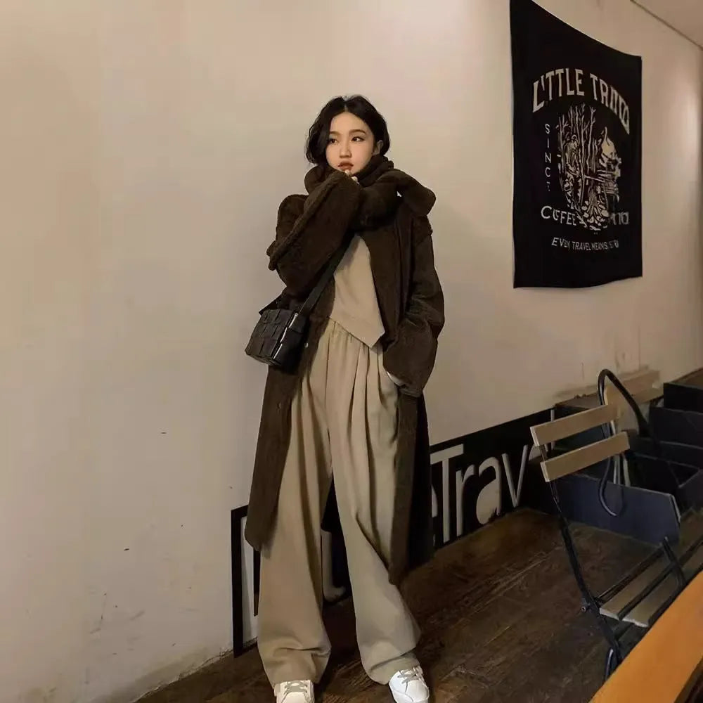 Brown loose-fit women's polyester sports suit with long sleeves and full-length trousers.