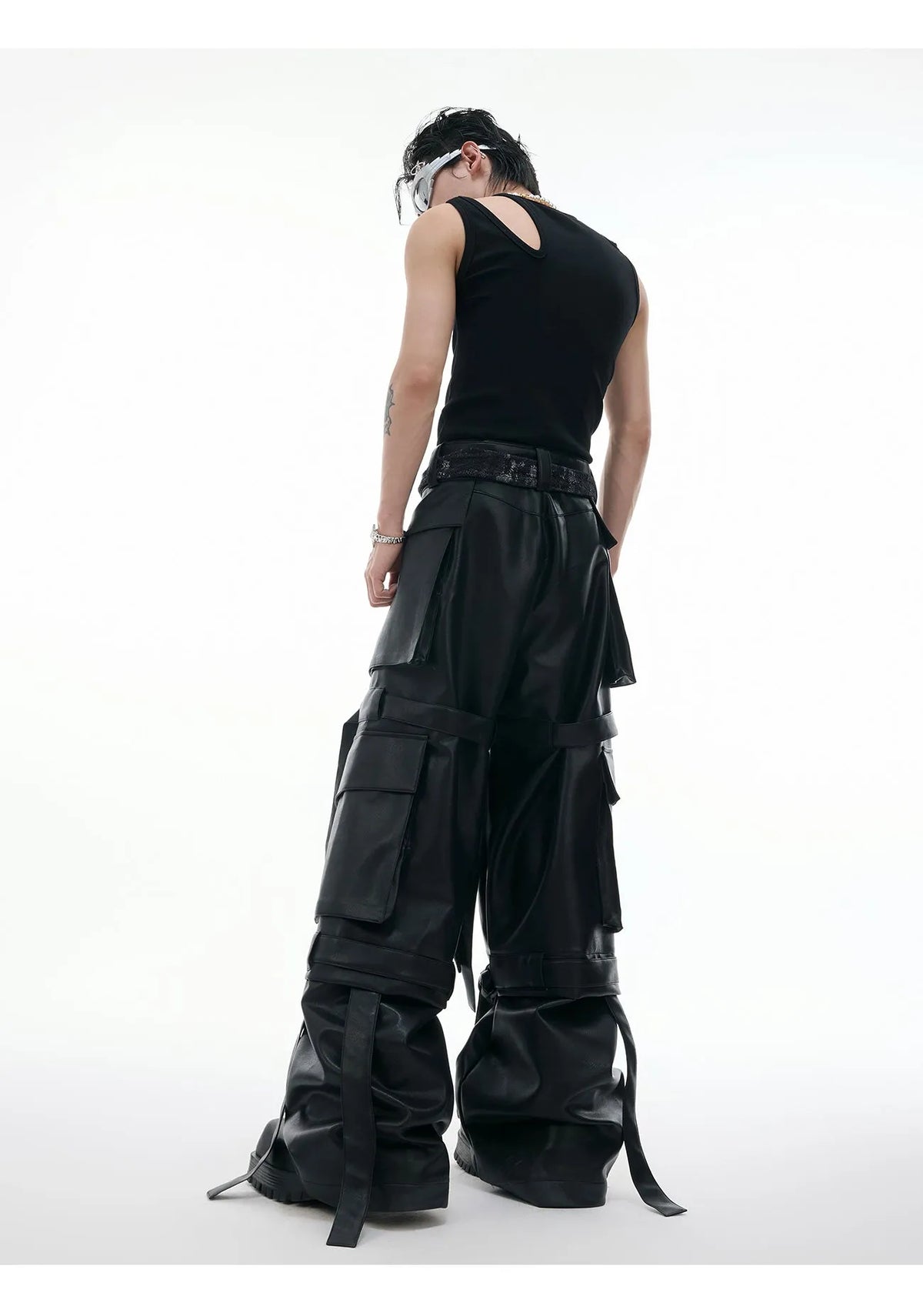 Black loose-fit men's trousers with quilted panels and multiple pockets.