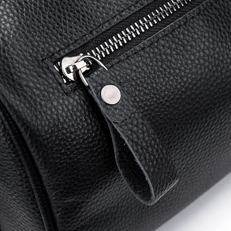 Black genuine leather crossbody bag with one-shoulder design showing 24x16x13cm dimensions