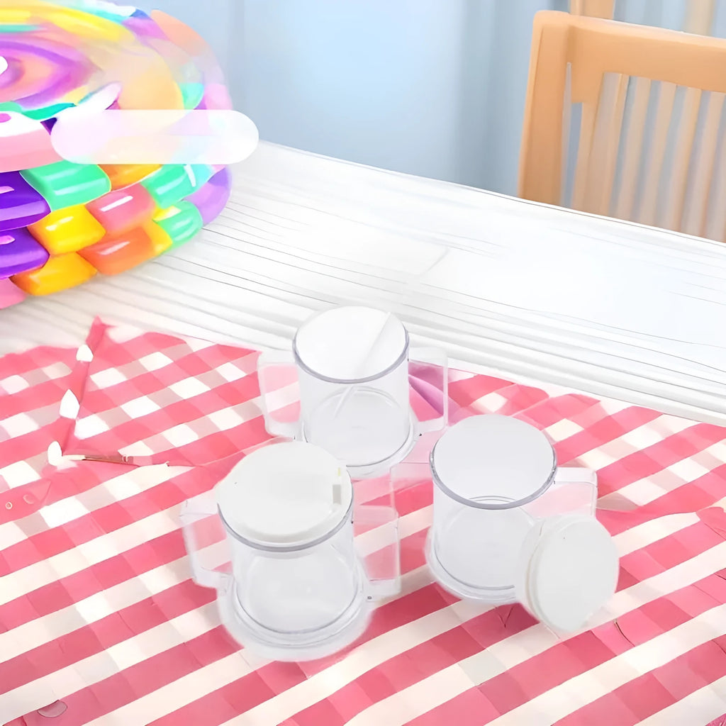 Transparent spill-proof plastic drinking cup on a table.