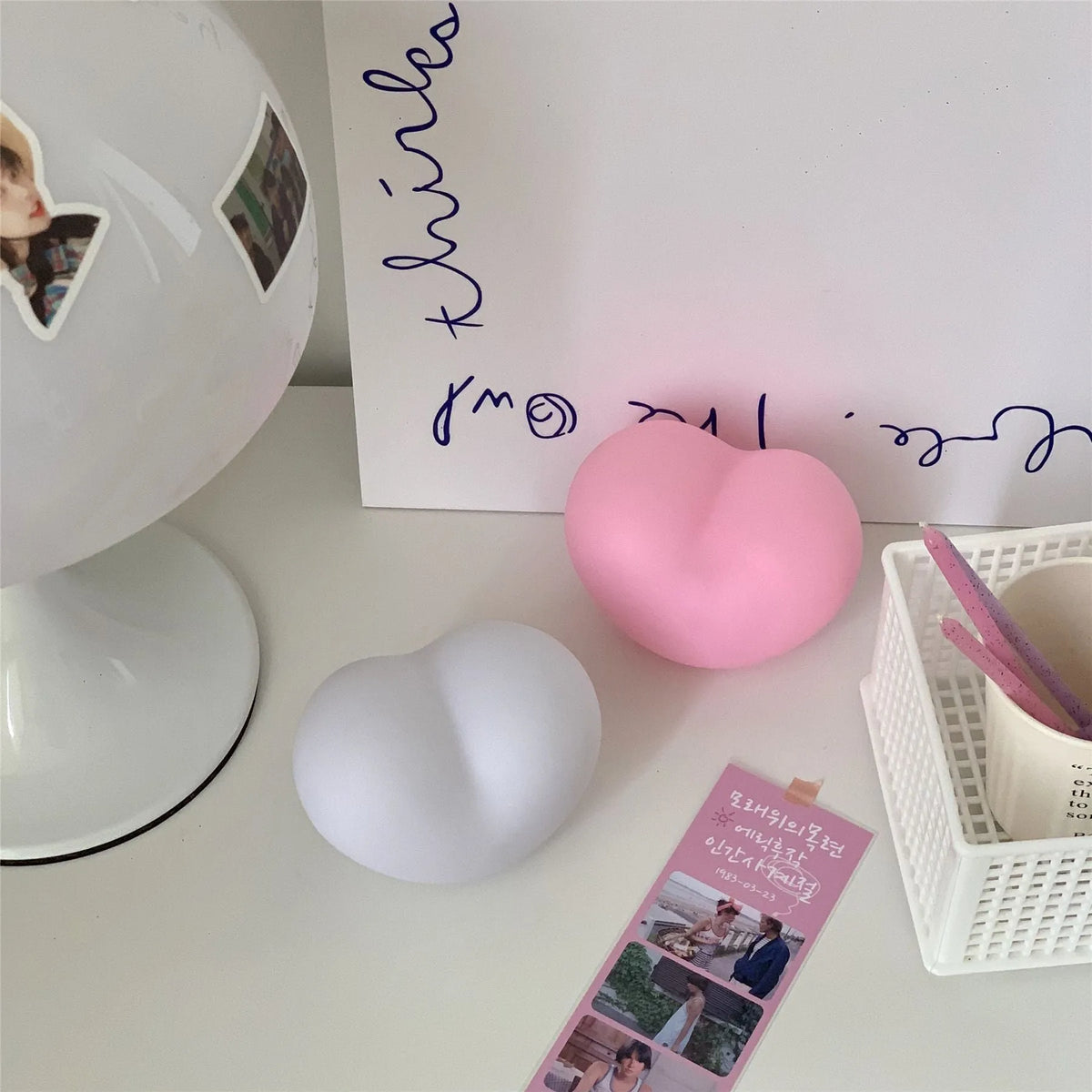 Vinyl atmosphere lamp in white and pink colours showing small and large size options