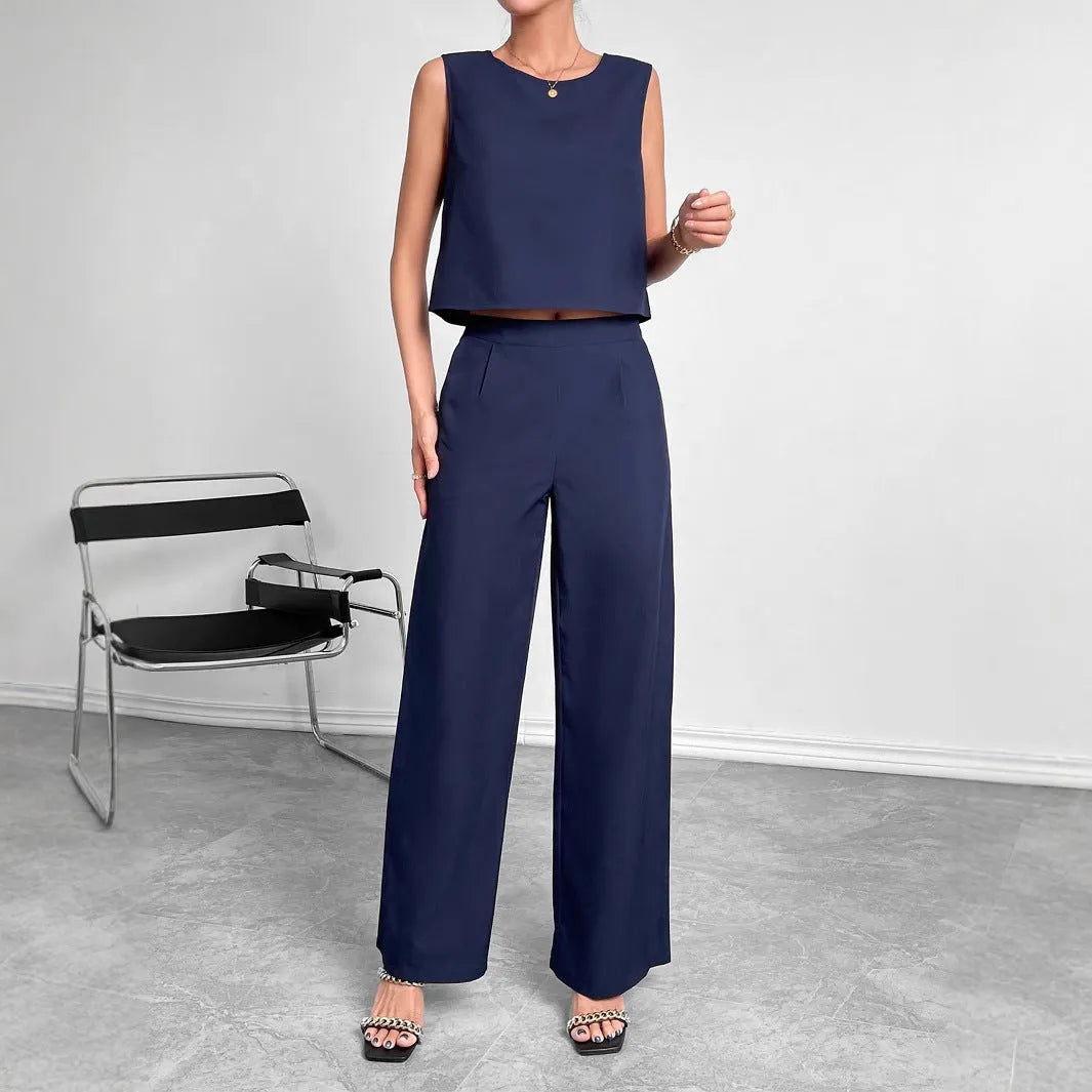 Red polyester two-piece set with sleeveless round neck top and wide leg trousers