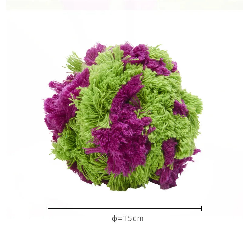 Purple plush dog ball with knotted seaweed texture measuring approximately 15cm diameter