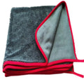 Grey car cleaning towel with black edge trim showing hemmed sides and spiral hair texture.