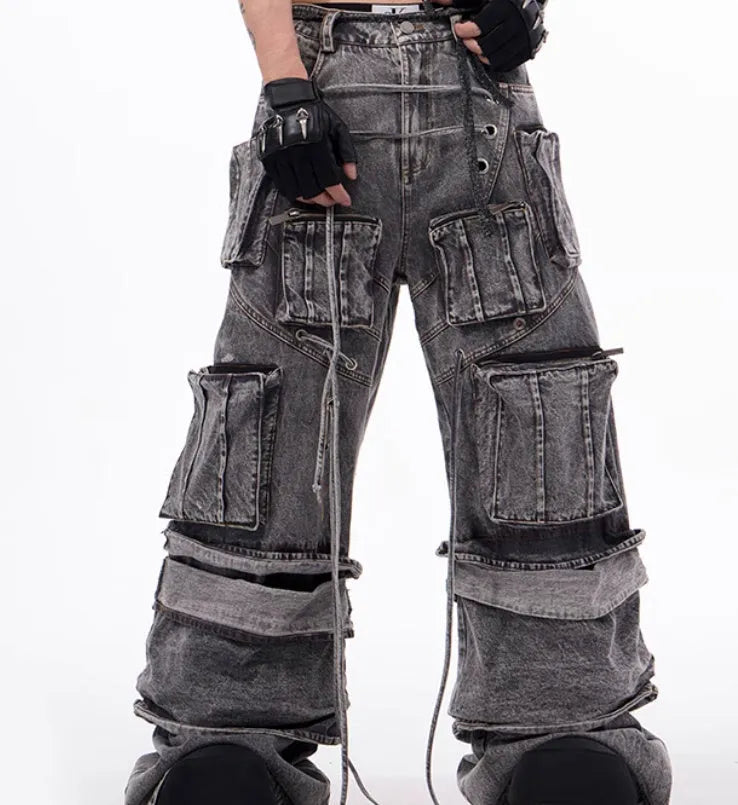 Grey distressed denim overalls for men with rope stitch detailing on the legs and chest.