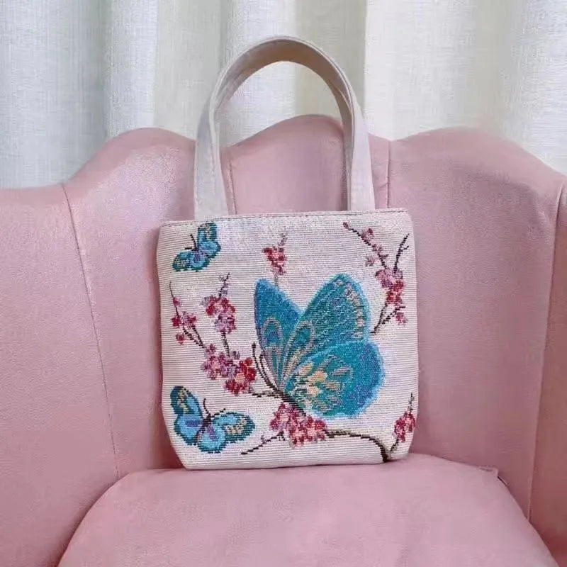 Gold wire embroidered canvas tote bag in choice of seven designs and three sizes.