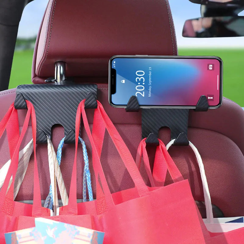 Black ABS car hook with integrated mobile phone bracket for rear seat storage.
