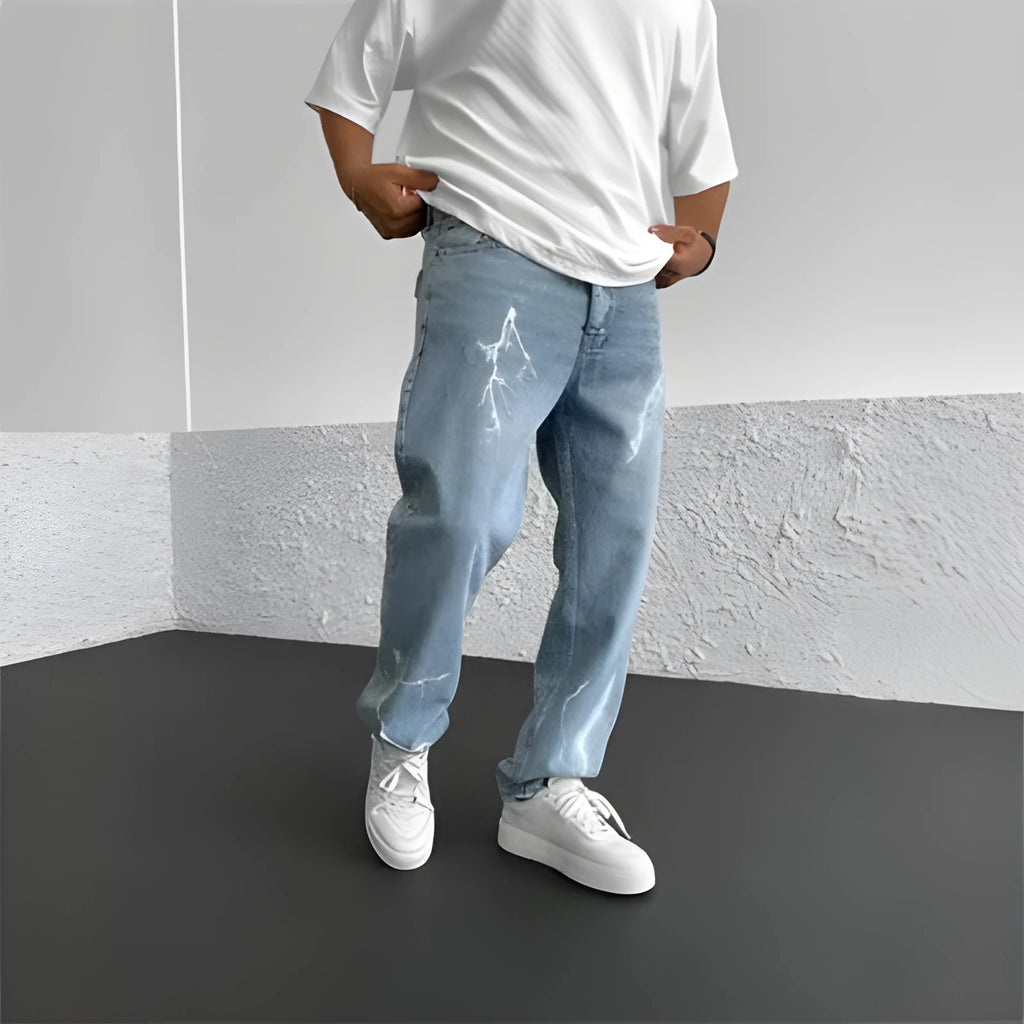 Men's blue straight-leg denim jeans with loose wide-leg cut and zip fly