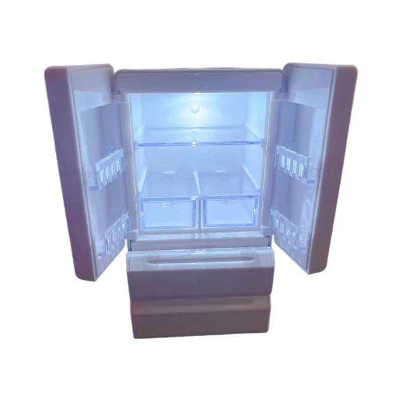 White plastic miniature candy toy model with lights on, showing detailed scene.