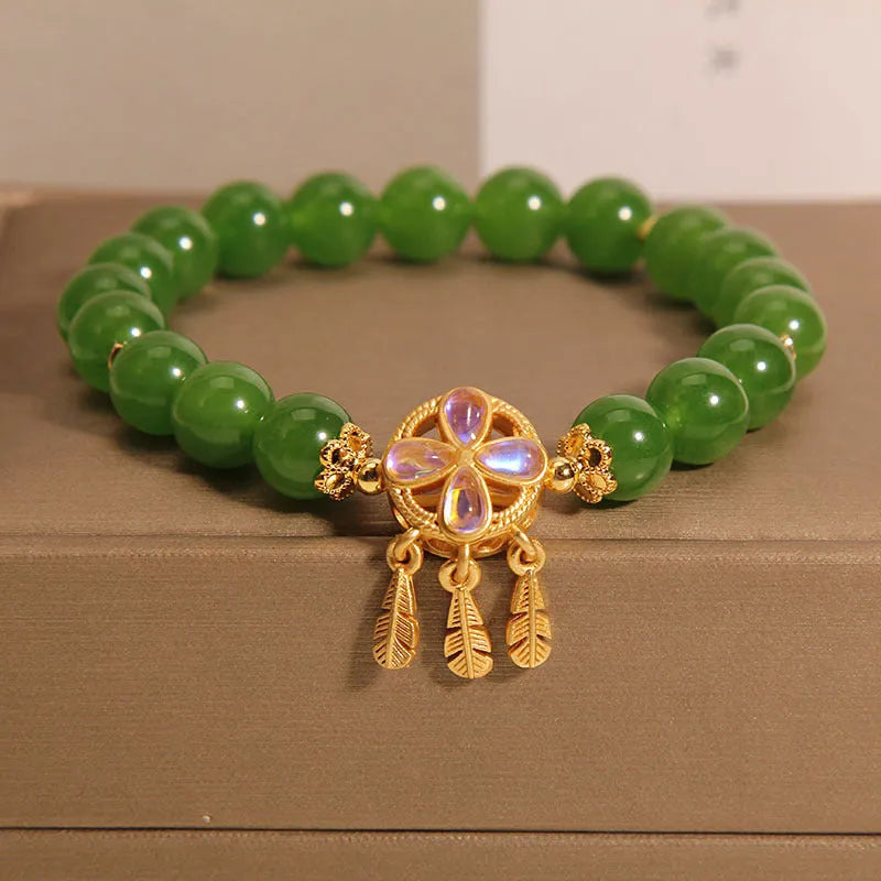 Green jasper bracelet with a four-leaf clover dream catcher crystal pendant for women.