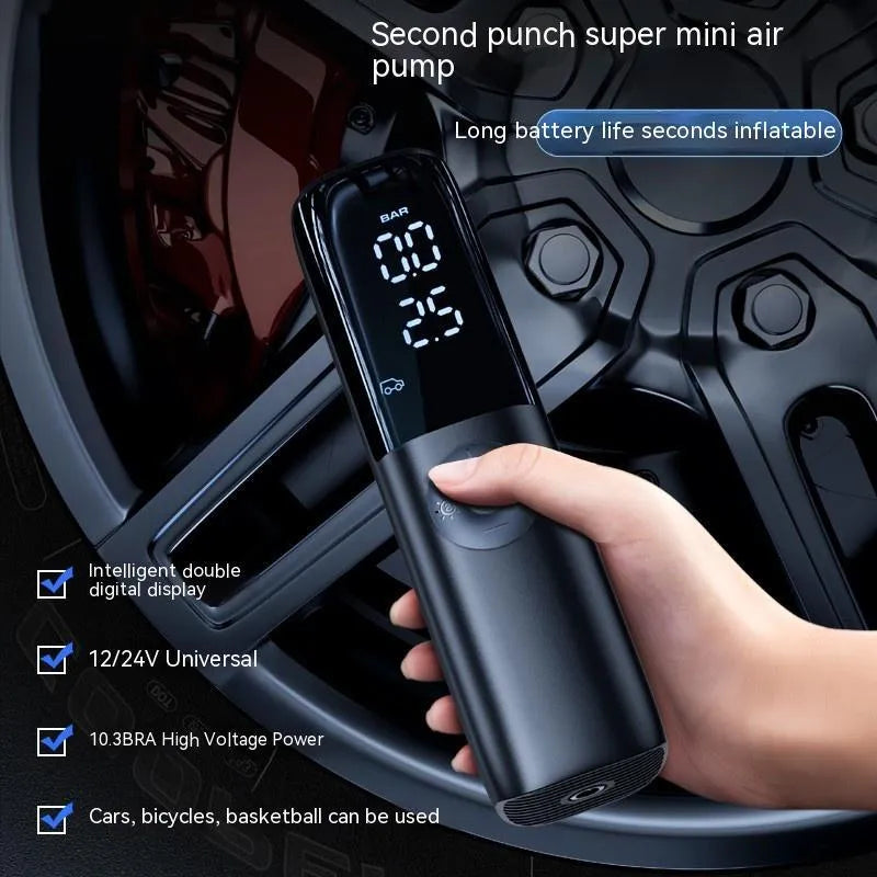 Black portable electric car air pump with tyre pressure gauge and inflation tube.