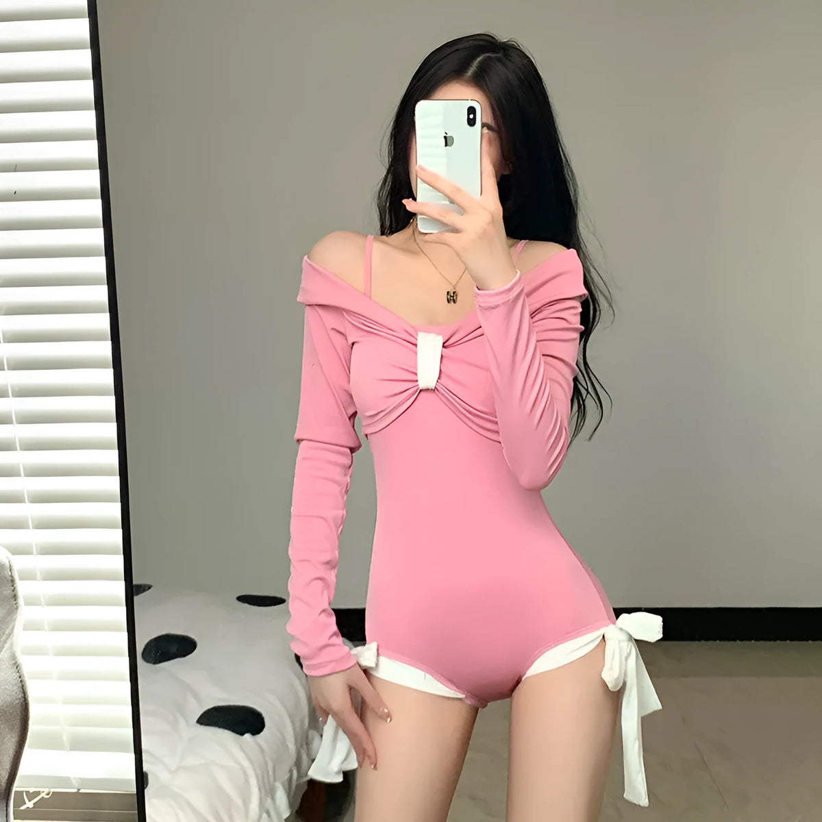 Women's long sleeve one-piece swimsuit in polyester fabric available in pink and black colours