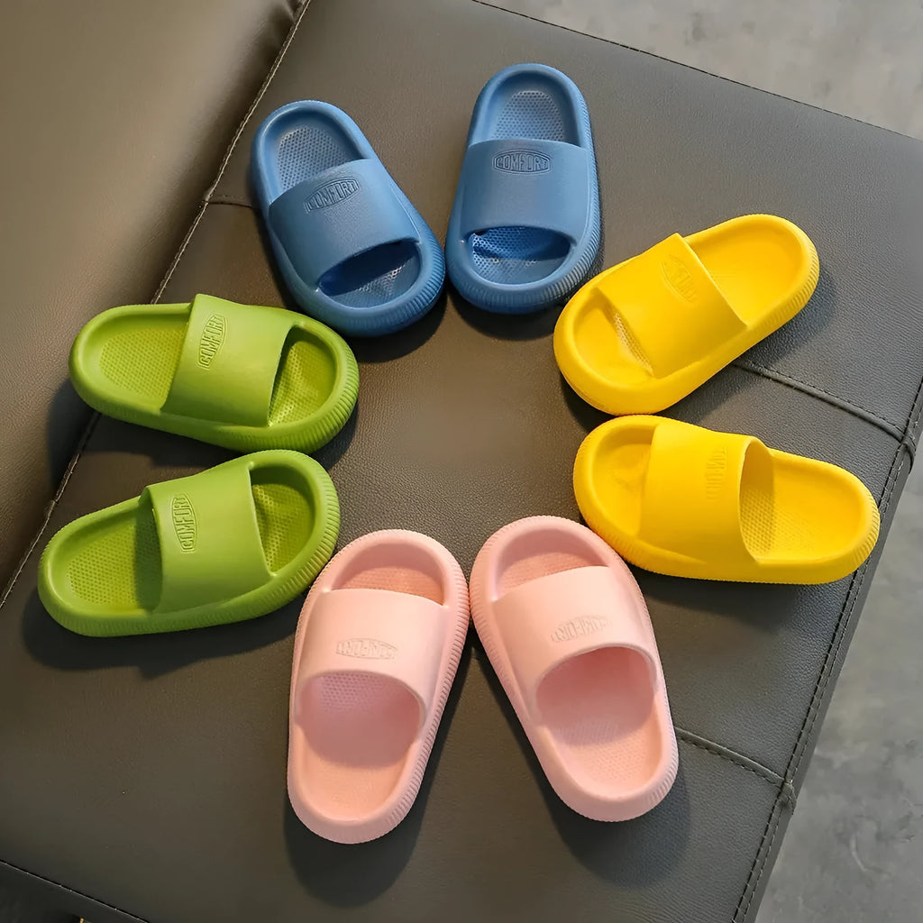 Children's EVA slippers in mixed colours with a textured non-slip sole, shown in sizes for kids.
