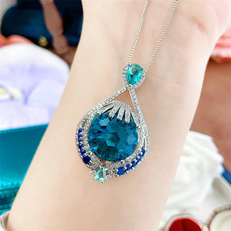 Blue crystal geometric pendant necklace with water wave chain for women's office wear