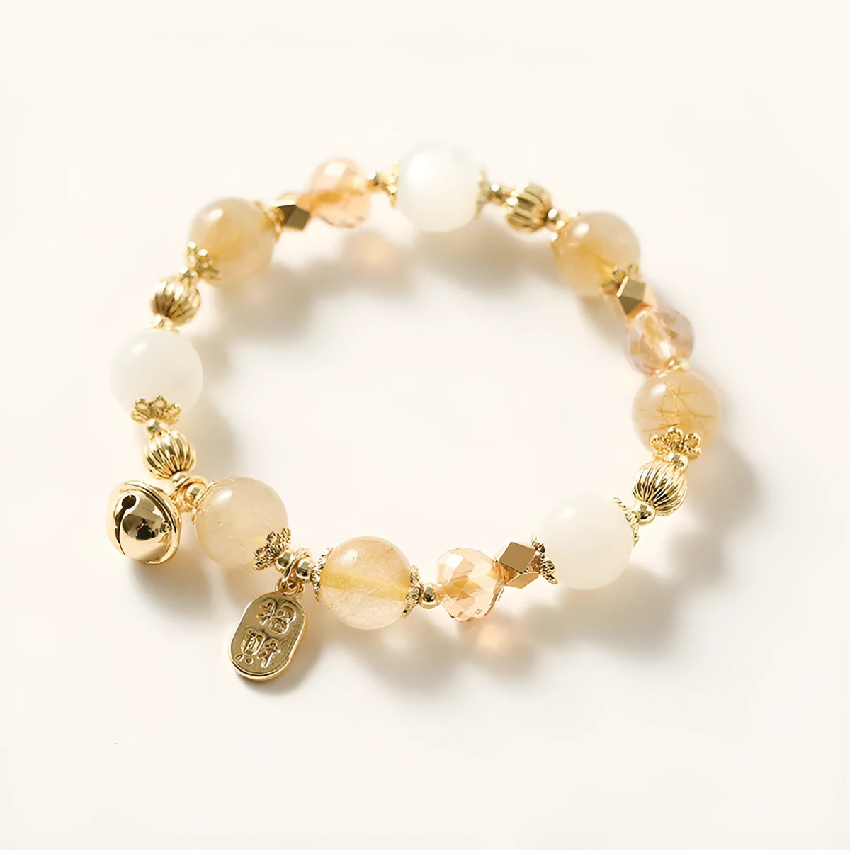 Gold coloured rutilated quartz crystal bracelet with electroplated finish in Korean style.